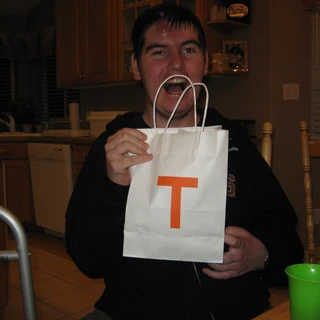 Alex holding his birthday present