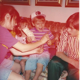 Alex holding money