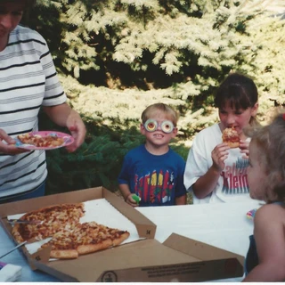 Alex eating pizza