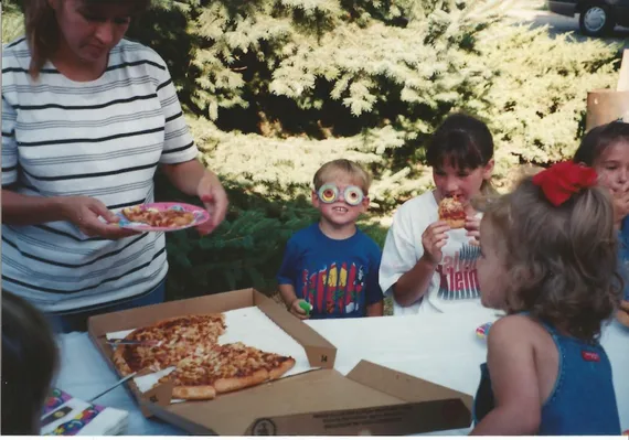Alex eating pizza